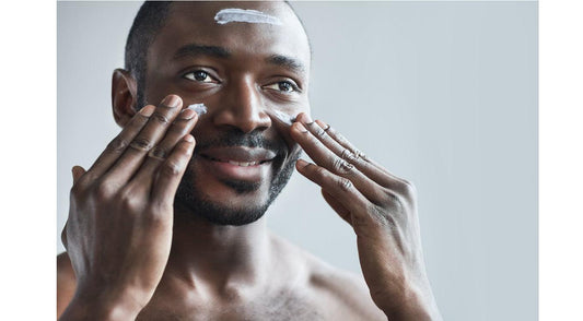  Man putting organic skincare products on face